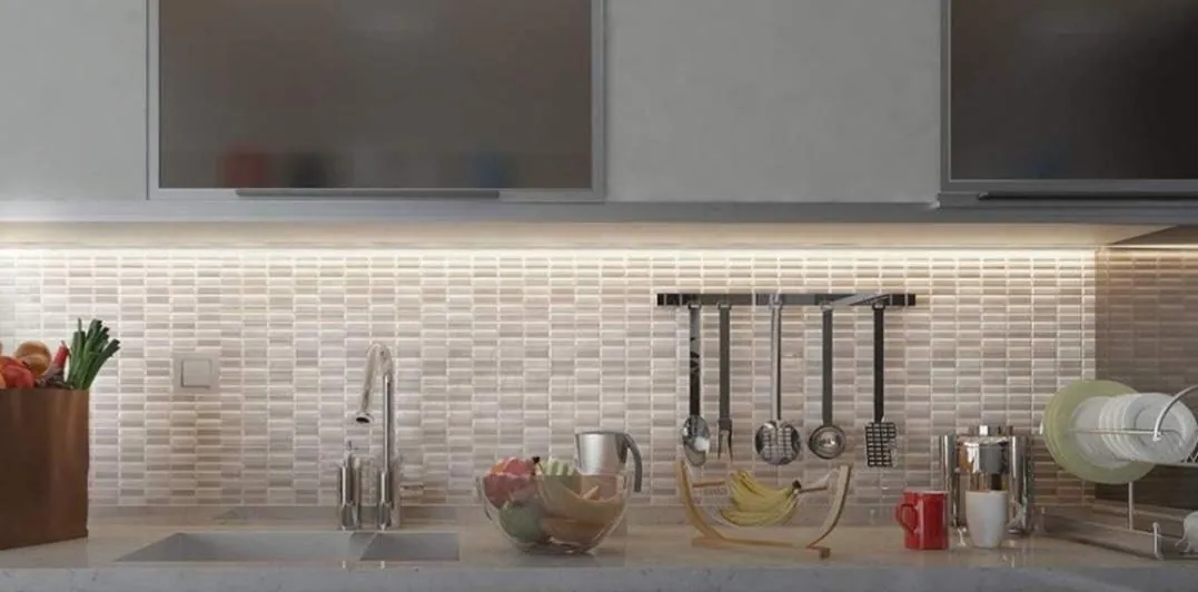 Kitchen under-cabinet lighting washing a tile backsplash.